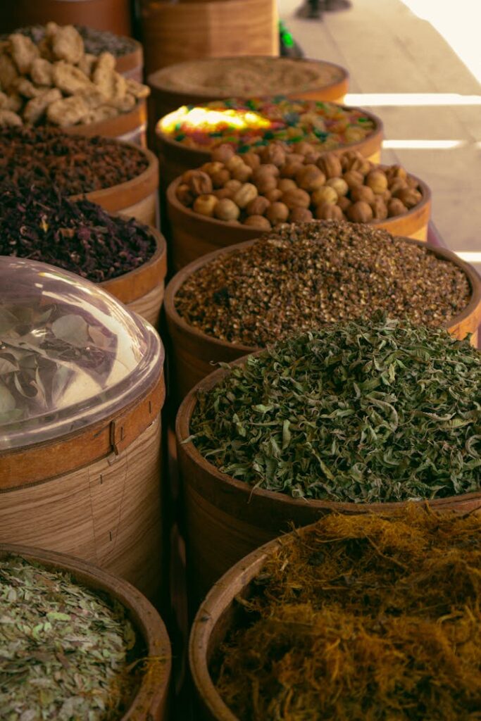 pexels-photo-27518341 Explore a colorful assortment of natural spices and herbs in a traditional market setting.